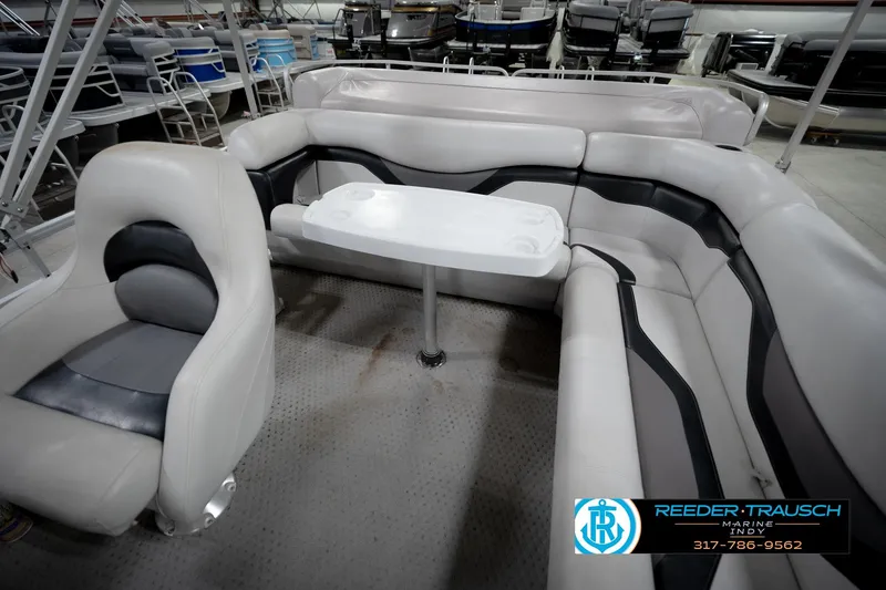 Slide: The Image of Interior of 1991 Godfrey Sanpan SP 2200 pontoon boat with cushioned seating. - 22