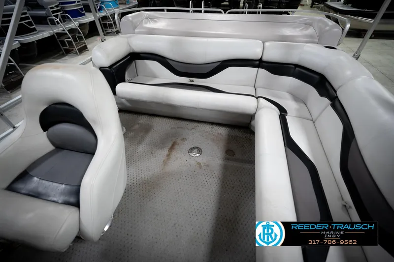 Slide: The Image of 1991 Godfrey Sanpan SP 2200 pontoon boat in indoor storage facility. - 23