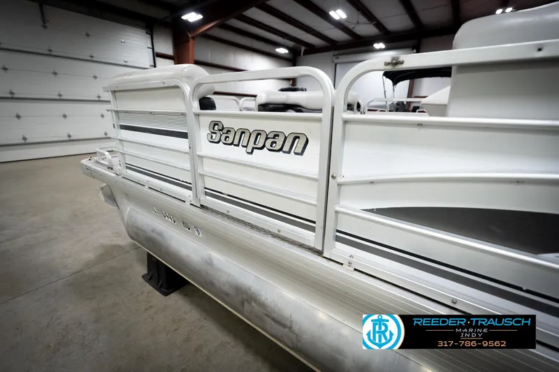 Slide: The Image of Interior of 1991 Godfrey Sanpan SP 2200 pontoon boat with white and gray seating. - 27