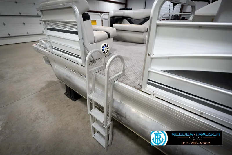 Slide: The Image of Interior of 1991 Godfrey Sanpan SP 2200 pontoon boat with white and gray seating. - 28