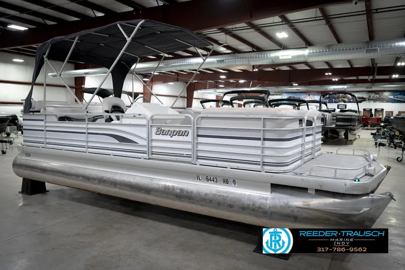 Slide: The Image of 1991 Godfrey Sanpan SP 2200 pontoon boat in indoor showroom, front view. - 5