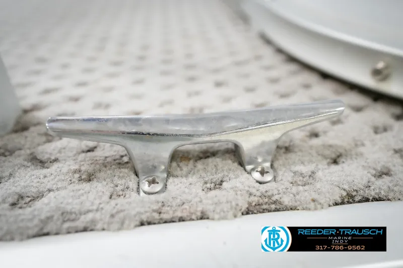 Slide: The Image of Close-up of a metal cleat on a 1991 Godfrey Sanpan SP 2200 boat. - 54