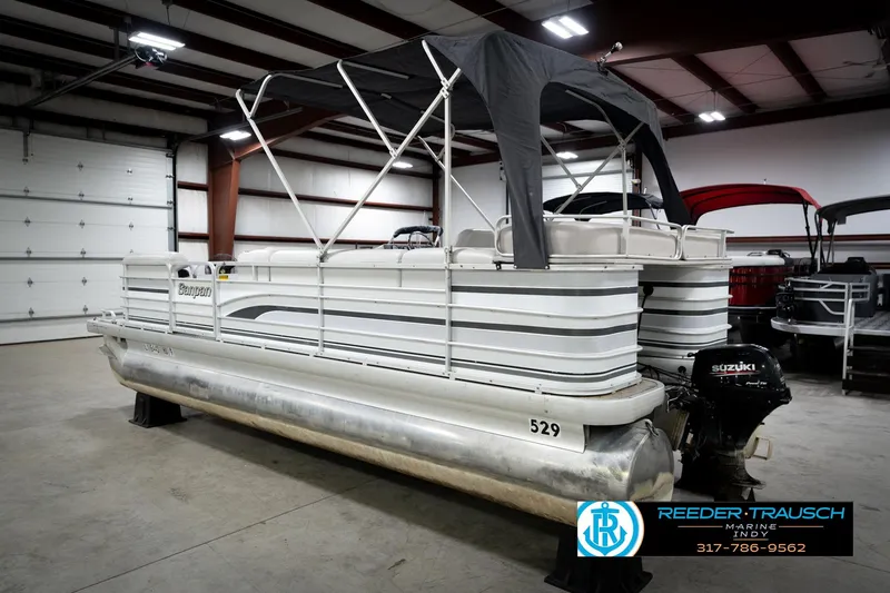 Slide: The Image of 1991 Godfrey Sanpan SP 2200 pontoon boat in indoor storage with canopy. - 9