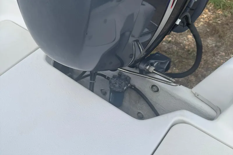 Slide: The Image of 2010 Carolina Skiff JVX16CC boat engine detail, showing motor and mounting area. - 10