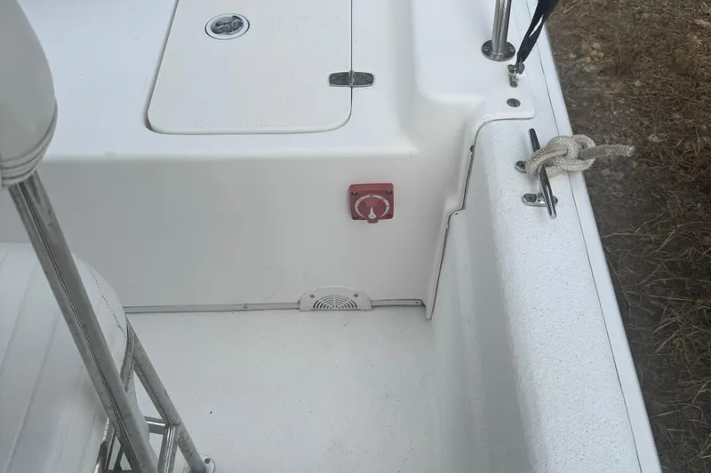 Slide: The Image of 2010 Carolina Skiff JVX16CC boat interior with storage hatch and cleat. - 9