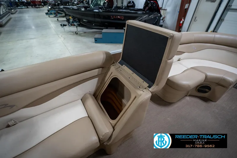 Slide: The Image of 2017 Bennington 18 SLX pontoon boat interior with open storage compartment. - 23