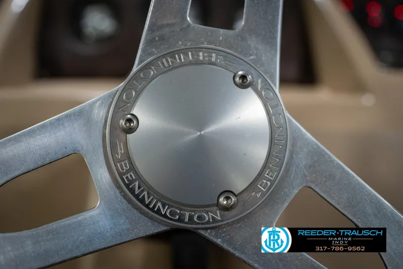 Slide: The Image of Steering wheel of 2017 Bennington 18 SLX boat, featuring Reeder Trausch Marine logo. - 29