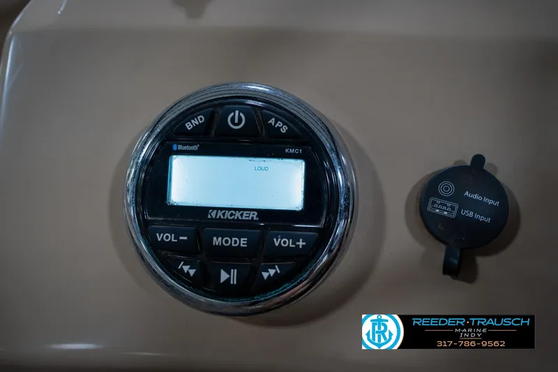 Slide: The Image of Kicker audio system and USB input on 2017 Bennington 18 SLX boat dashboard. - 30