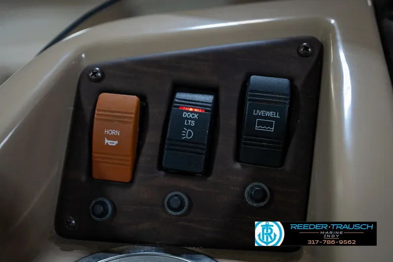 Slide: The Image of Control panel of a 2017 Bennington 18 SLX boat with horn, dock lights, and livewell switches. - 31