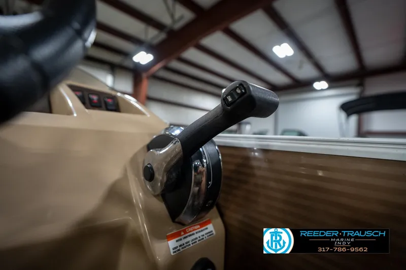 Slide: The Image of Close-up of 2017 Bennington 18 SLX boat throttle in a showroom setting. - 37