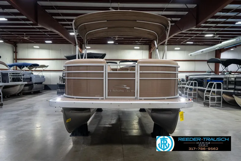 Slide: The Image of 2017 Bennington 18 SLX pontoon boat in indoor showroom, front view. - 4