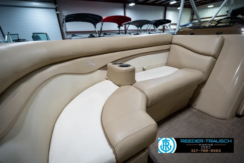 Slide: The Image of 2017 Bennington 18 SLX boat interior with beige seating and cup holder. - 41