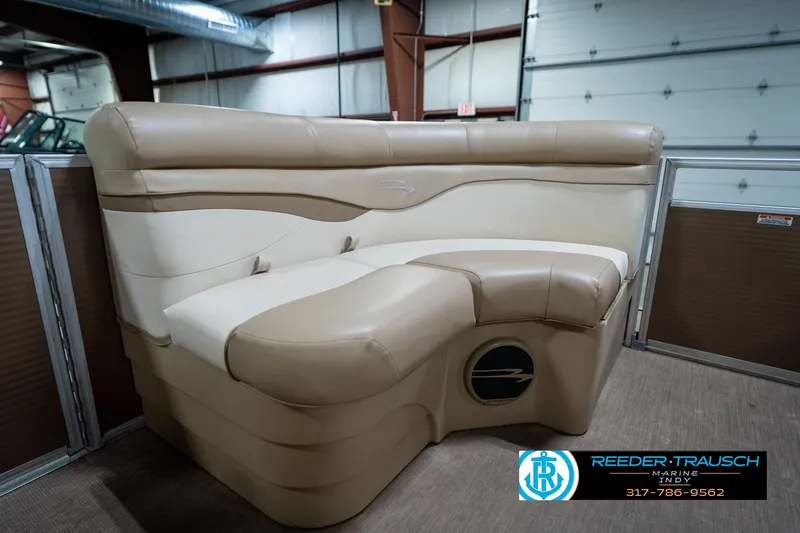 Slide: The Image of 2017 Bennington 18 SLX boat interior with beige seating in a showroom. - 42