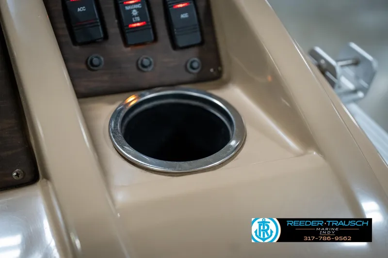 Slide: The Image of Close-up of 2017 Bennington 18 SLX boat console with cup holder and switches. - 45