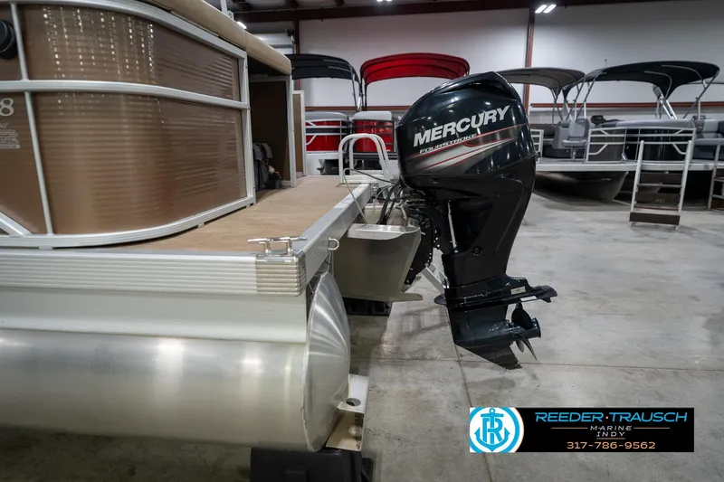 Slide: The Image of 2017 Bennington 18 SLX pontoon boat with Mercury outboard motor in showroom. - 47