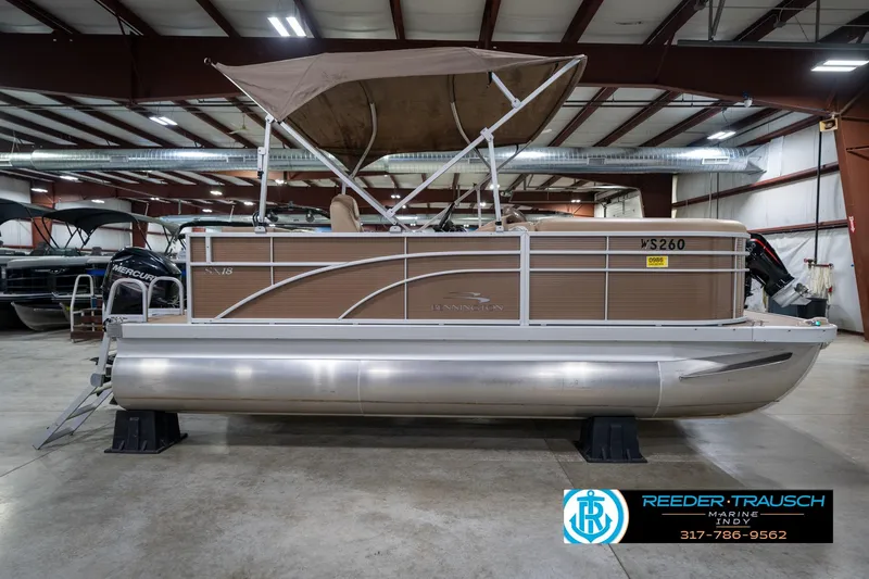 Slide: The Image of 2017 Bennington 18 SLX pontoon boat in indoor showroom, side view. - 6