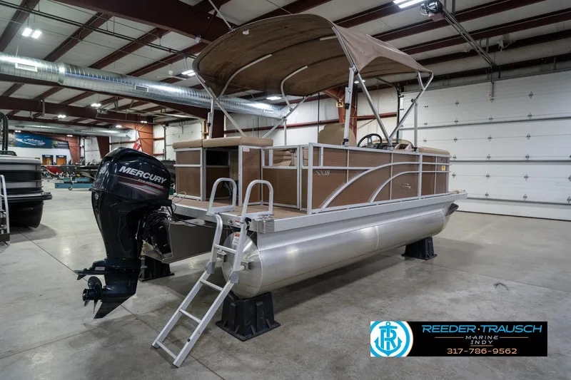Slide: The Image of 2017 Bennington 18 SLX pontoon boat with Mercury engine in indoor showroom. - 7