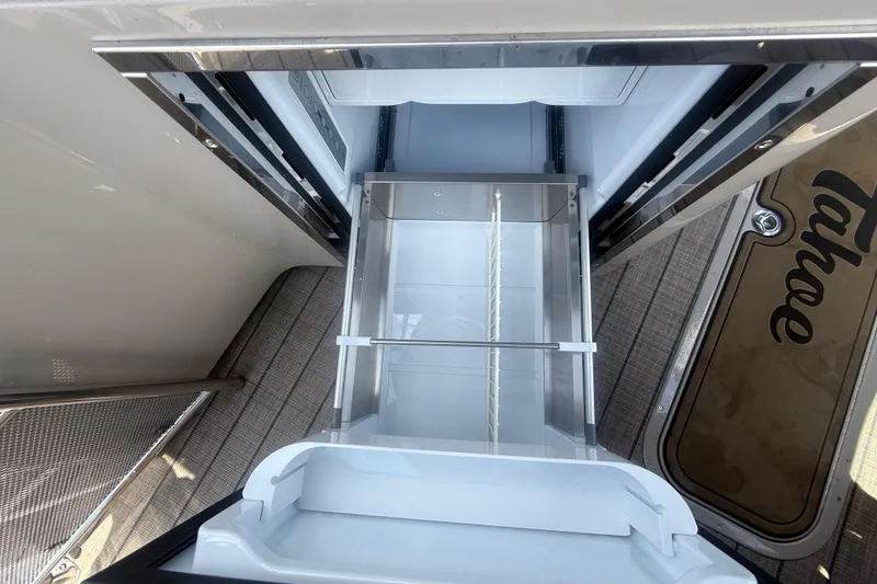 Slide: The Image of 2024 Tahoe Pontoon Grand Tahoe Elite Windshield 27' interior storage compartment. - 33