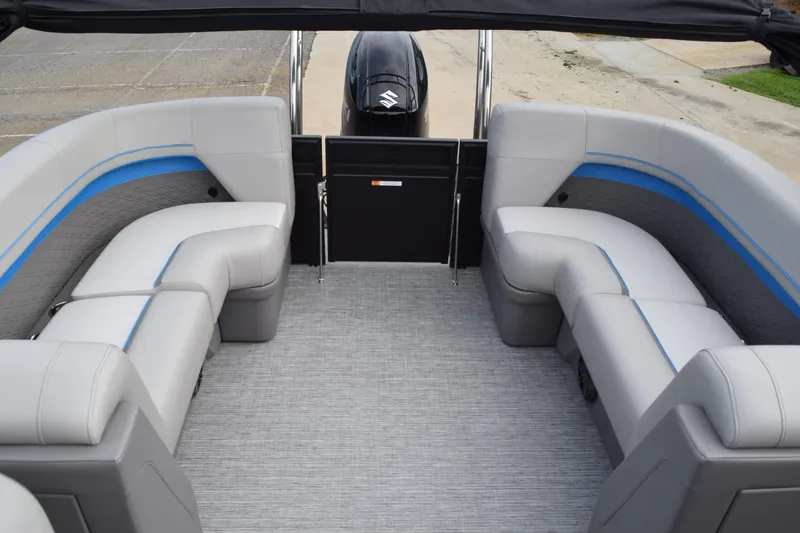 Slide: The Image of 2025 Qwest L-Class 822 RLS pontoon boat interior with gray seating and blue accents. - 14