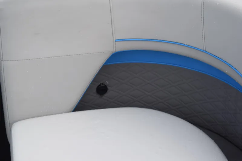 Slide: The Image of 2025 Qwest L-Class 822 RLS boat interior with gray and blue cushioned seating. - 15