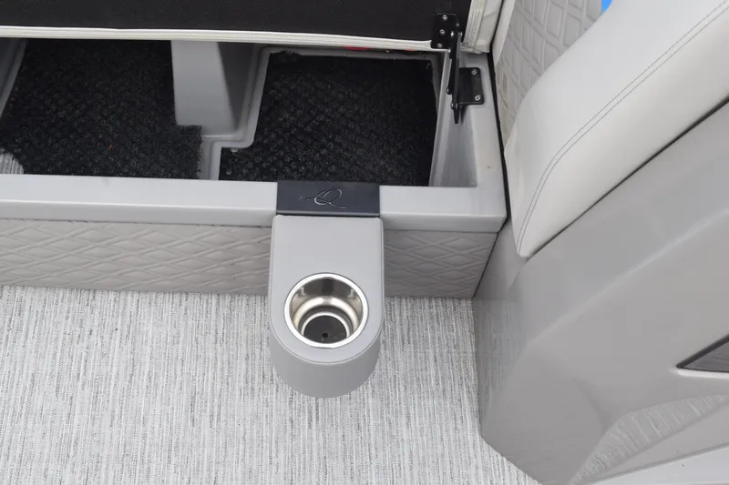 Slide: The Image of 2025 Qwest L-Class 822 RLS interior with cup holder and storage compartment. - 20