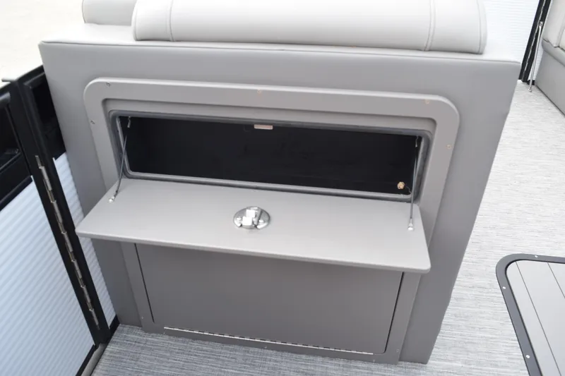Slide: The Image of 2025 Qwest L-Class 822 RLS boat interior storage compartment with open lid. - 24