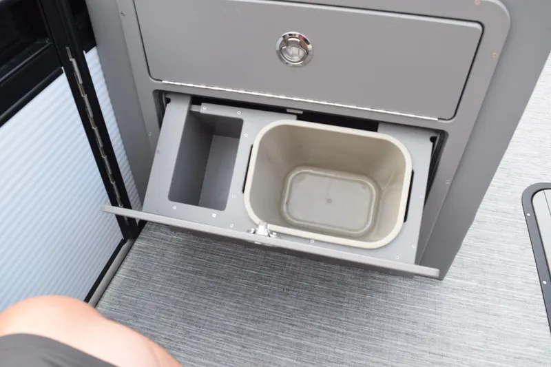 Slide: The Image of Pull-out storage compartment in 2025 Qwest L-Class 822 RLS boat interior. - 25