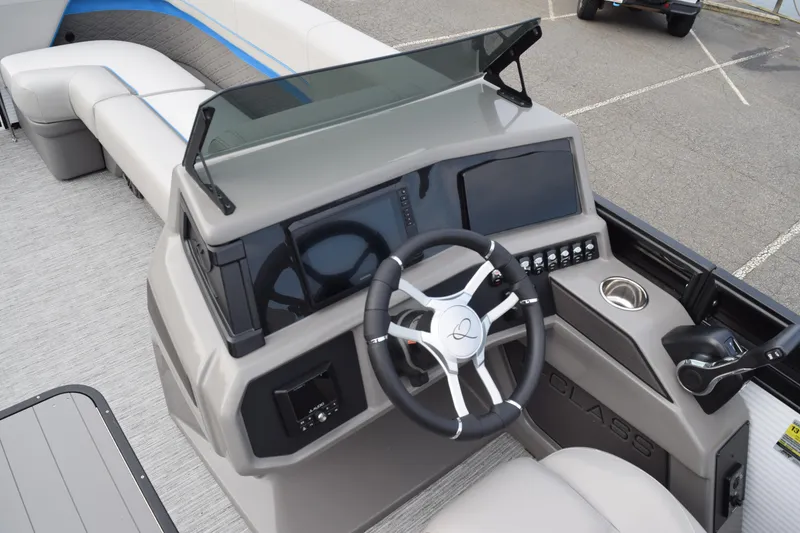 Slide: The Image of 2025 Qwest L-Class 822 RLS boat dashboard with steering wheel and control panel. - 26