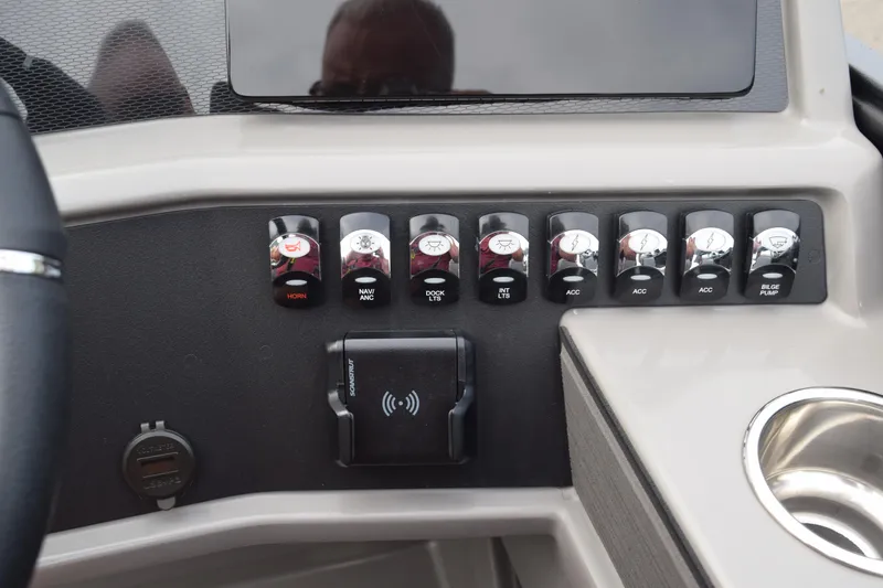 Slide: The Image of Control panel of 2025 Qwest L-Class 822 RLS boat with switches and cup holder. - 27