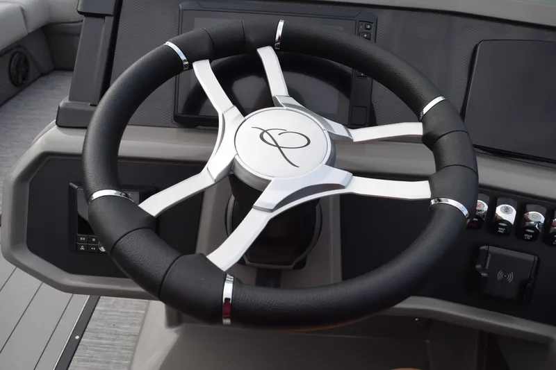 Slide: The Image of Steering wheel of 2025 Qwest L-Class 822 RLS boat, featuring sleek design and controls. - 32