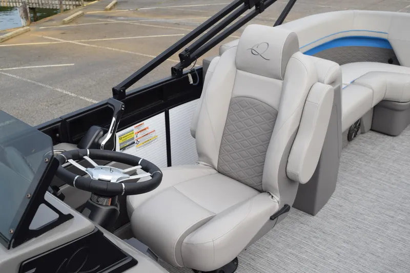 Slide: The Image of 2025 Qwest L-Class 822 RLS boat interior with luxury seating and steering wheel. - 40