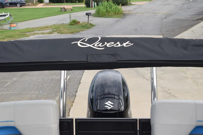 Slide: The Image of 2025 Qwest L-Class 822 RLS boat with Suzuki engine, parked on a driveway. - 41