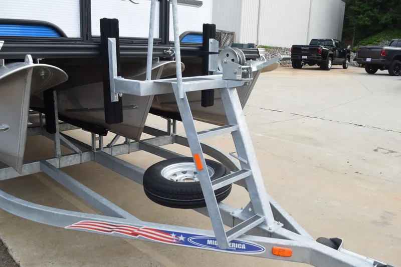 Slide: The Image of Trailer for 2025 Qwest L-Class 822 RLS pontoon boat in parking lot. - 45