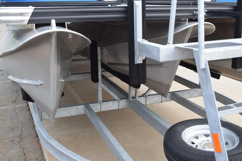 Slide: The Image of 2025 Qwest L-Class 822 RLS pontoon boat on trailer, showcasing aluminum hull design. - 47