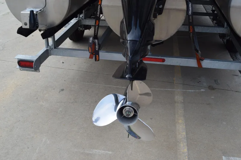 Slide: The Image of Rear view of 2025 Qwest L-Class 822 RLS boat on trailer, showing propeller. - 8