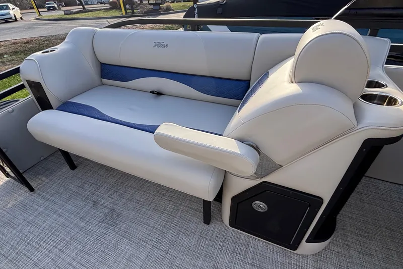 Slide: The Image of Luxury seating on 2026 JC Neptoon 25TT Sport pontoon boat, featuring plush upholstery and cup holders. - 12