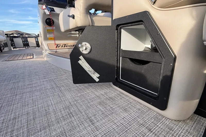 Slide: The Image of Interior view of 2026 JC Neptoon 25TT Sport boat with open storage compartment. - 18