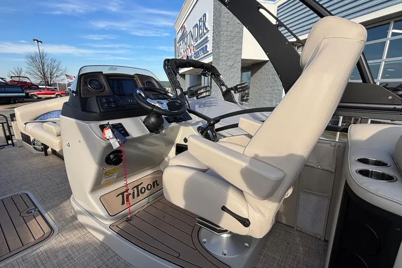 Slide: The Image of 2026 JC Neptoon 25TT Sport boat interior with helm and seating area. - 20