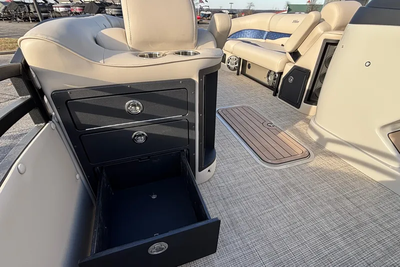 Slide: The Image of Interior of 2026 JC Neptoon 25TT Sport boat with open storage drawers. - 32