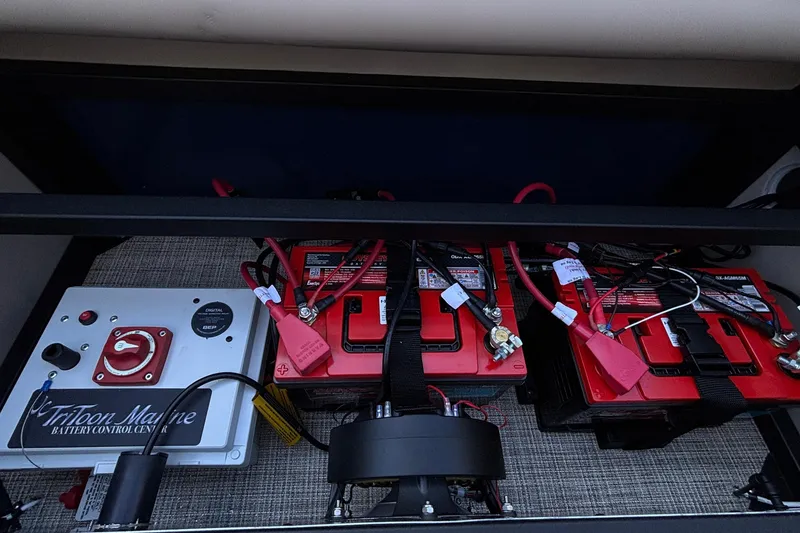 Slide: The Image of Battery setup in 2026 JC Neptoon 25TT Sport boat, featuring Triton Marine control. - 8