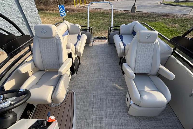 Slide: The Image of Luxurious interior of 2026 JC Neptoon 25TT Sport pontoon boat with plush seating. - 9