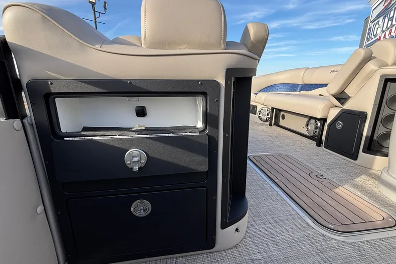 Slide: The Image of Interior of 2026 JC Neptoon 25TT Sport boat with seating and storage compartments. - 30