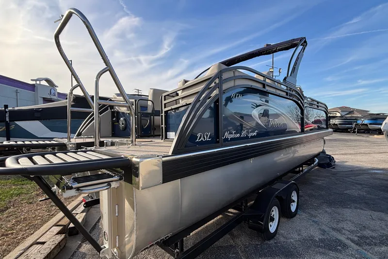 Slide: The Image of 2026 JC Neptoon 25TT Sport pontoon boat on trailer, parked outdoors. - 4
