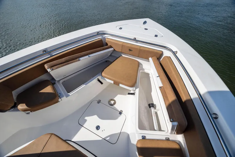 Slide: The Image of 2023 Sea Pro 219 Deep V CC boat interior with cushioned seating and storage compartments. - 11