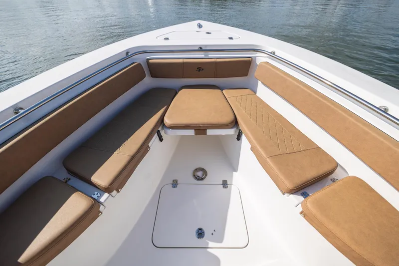 Slide: The Image of 2023 Sea Pro 219 Deep V CC boat interior with tan cushioned seating. - 12