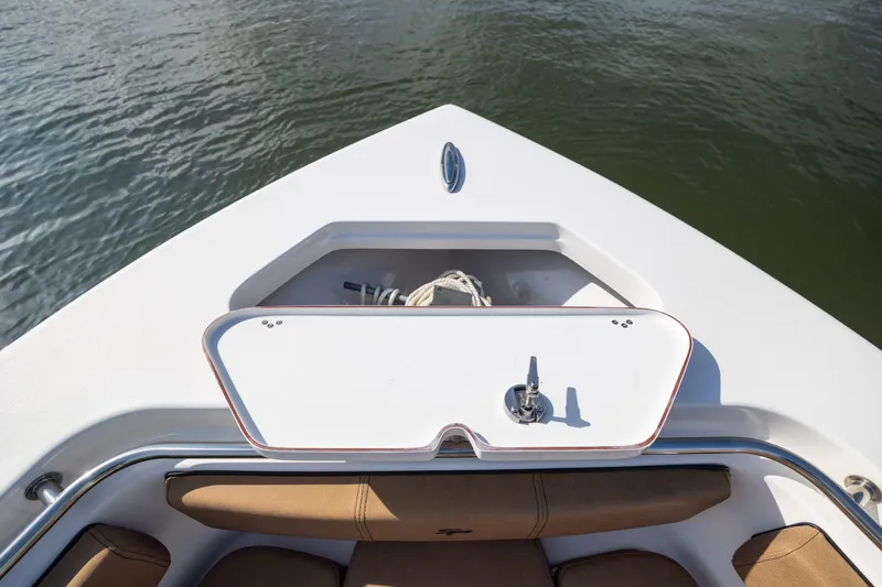 Slide: The Image of 2023 Sea Pro 219 Deep V CC boat bow with anchor storage and seating. - 13