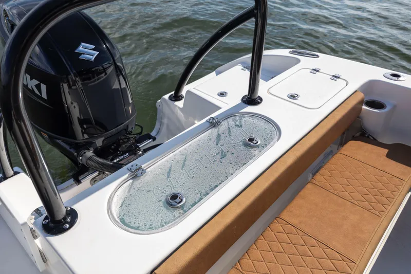 Slide: The Image of 2023 Sea Pro 219 Deep V CC boat with Suzuki engine, featuring a cushioned seating area. - 24