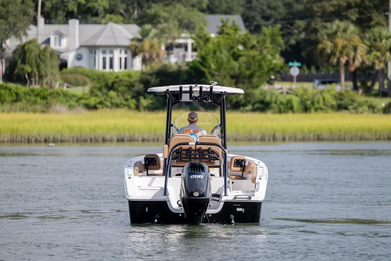 Slide: The Image of 2023 Sea Pro 219 Deep V CC boat cruising on a scenic waterway. - 9