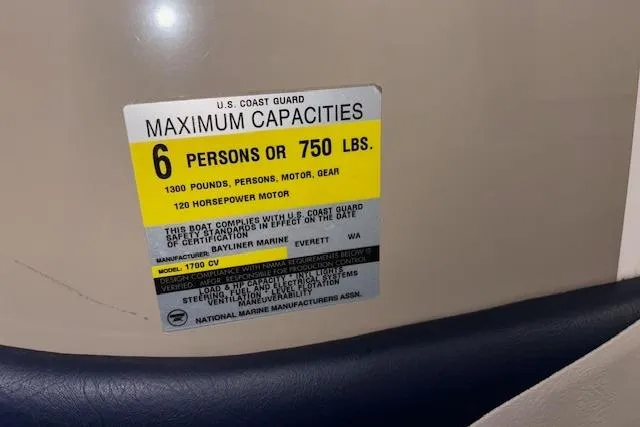 Slide: The Image of 1996 Bayliner 1700 LS capacity label: 6 persons or 750 lbs, 120 horsepower motor. - 14