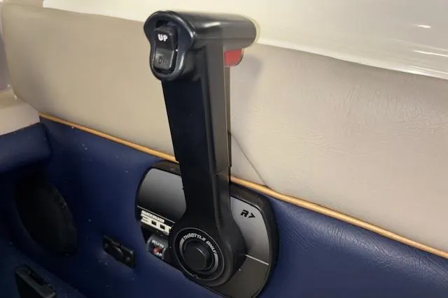 Slide: The Image of Throttle control lever in a 1996 Bayliner 1700 LS boat interior. - 17